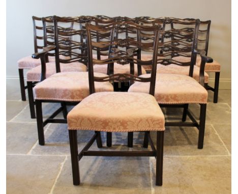 A set of ten Chippendale style mahogany dining chairs, early 20th century, each with a pierced ladder back above a pink folia