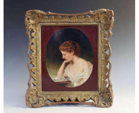 Follower of Sir Francis Grant RA (1803-1878), Oil on canvas, Portrait of a seated lady reading, Signed 'Grant' and dated '189