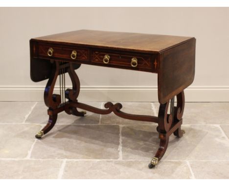 A Regency rosewood sofa table, the rectangular and cross banded drop leaf top above a pair of frieze drawers with opposing fa