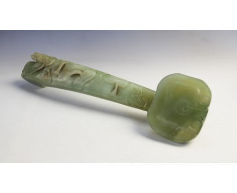 A Chinese jade ruyi sceptre, 20th century, the sceptre of large proportions carved with lotus blooms to the shaft and termina