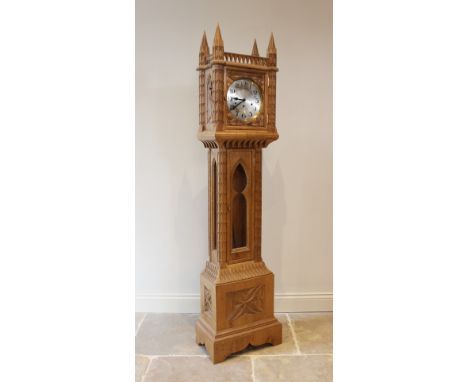 An ecclesiastical carved oak grandmother clock, 20th century, the hood inspired by Lichfield Cathedral, movement striking on 