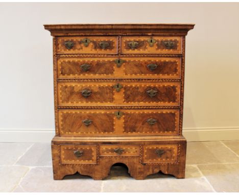 An 18th century and later walnut and pine chest on stand, the moulded pediment above an arrangement of two short and three lo