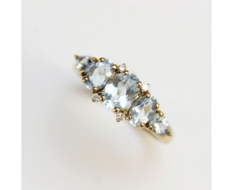 An 'aquamarine' and diamond set ring, Birmingham 1999, the five graduated untested aquamarine coloured gemstones interspersed