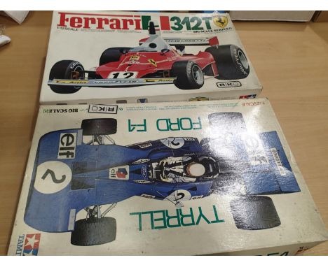 Two Tamiya 1/12 scale Formula 1 racing car kits, Ferrari 312T, just started, appears complete with decals and instructions, a