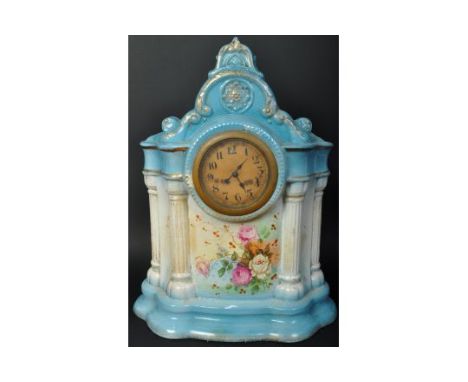 An early 20th century Staffordshire porcelain mantel clock. Inset barrel 8-day movement with champagne coloured dial with Ara