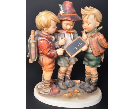 
A 20th century Western German Goebel porcelain figure group of School Boys. Model No&nbsp;170 with markings to base. Model&n