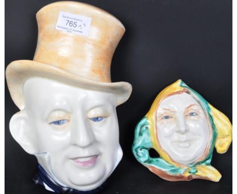 Two 20th century Beswick Ware ceramic wall plaques. The lot comprising of a large man head shaped wall plaque marked to back 