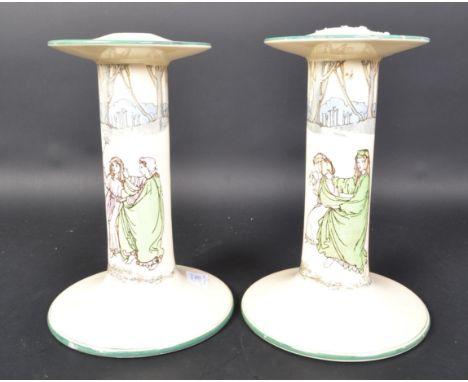 A pair of Royal Doulton series ware ceramic large candle stick holders. (af) Having a lipped top, hand painted column on a ci