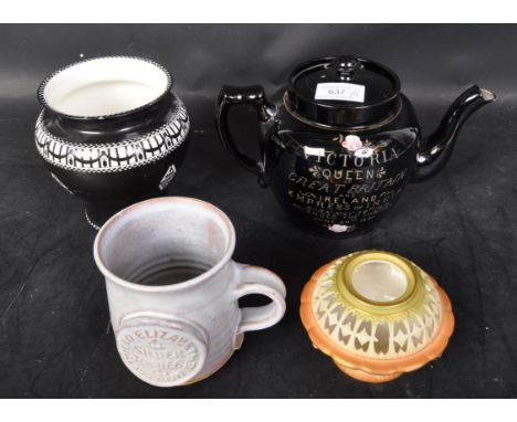 An assorted collection of 19th century and later ceramics to include a commemorative black teapot celebrating the record reig