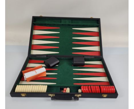 A large late 20th Century backgammon case, with red and cream counters, dice on a green baize