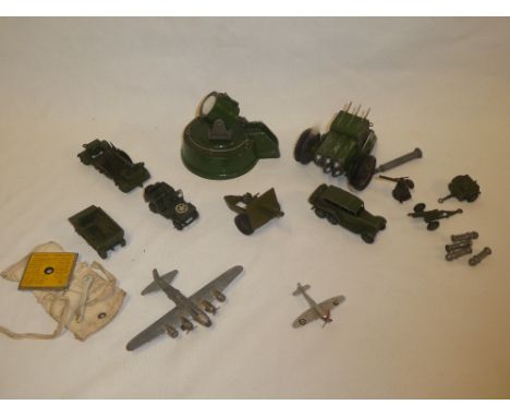 A selection of various military diecast vehicles including Astra Rocket Launcher with searchlight; Dinky Jeep, field gun, Din