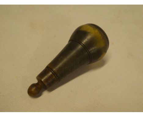 A late 18th/early 19th century cow horn pistol powder flask with tapered body and stopper