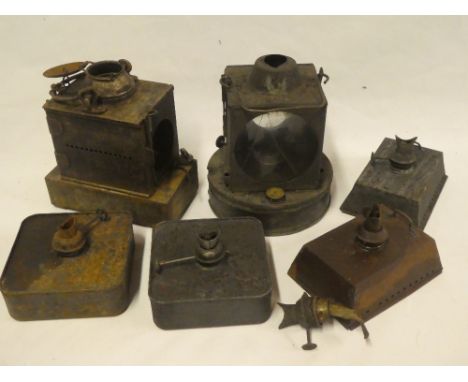 A Southern Railways oil lamp, one other various railway oil lamp and a selection of various oil lamp fitments