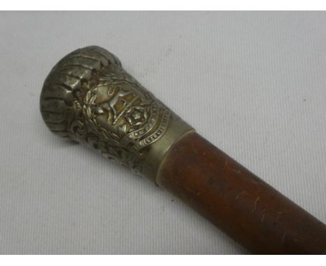 A nickel mounted Malucca military cane/swagger stick bearing the badge of the 13th Service Battalion Hampshire Regiment