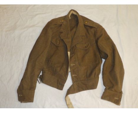 A Second War khaki battle dress blouse dated 1944