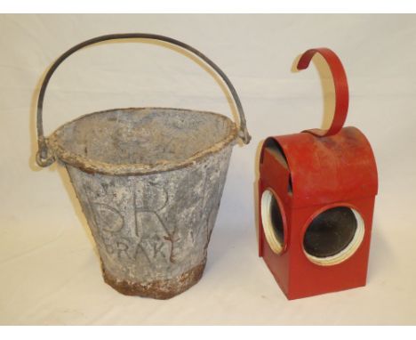A British Rail Western Region brake van water bucket and a British Rail trackside/roadside warning lamp (2)