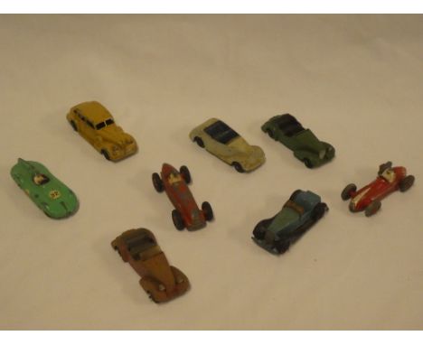 Eight various old Dinky diecast vehicles including Armstrong Siddeley, Alvis, Buick, Maseratti racing car etc.