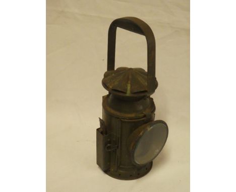 A Second War railway hand lantern with green military-style painted decoration dated 1945