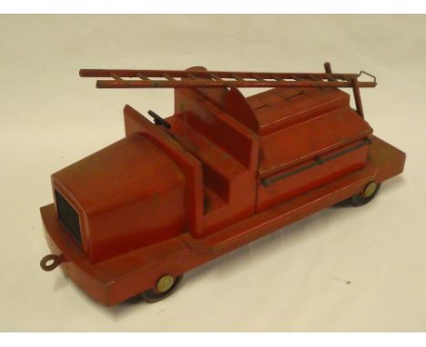 An old painted metal model fire engine with hinged rear compartment and swivelling ladder 14½" long