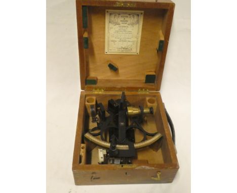 A brass mounted painted metal sextant by Kelvin &amp; Hughes Limited in fitted case