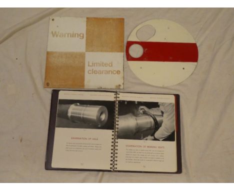 A painted aluminium shunting single disc, aluminium square sign "Warning Limited Clearance" and a Railway Service manual (3)