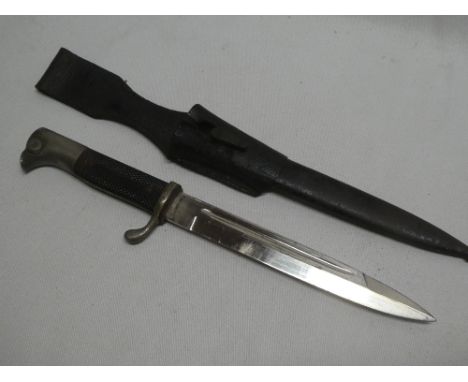 A Second War German Fire Brigade bayonet by Eickhorn with single edged blade in steel scabbard and leather frog