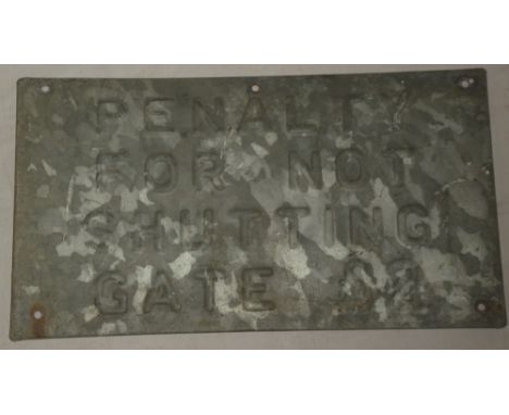 An old galvanised railway rectangular sign with pressed lettering "Penalty For Not Shutting The Gate £2" 11" x 20"