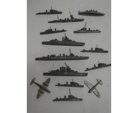 A selection of early lead battleship and warship figures and two Dinky aircraft