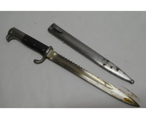 An unusual Second War German Mauser butcher bayonet with single edged saw-back by Erfurt in steel scabbard, the hilt and scab