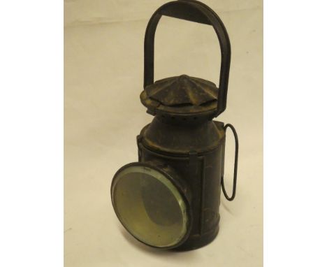 A painted metal railway hand lamp with internal oil lamp fitment
