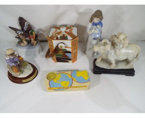 A good lot to include a Japanese hand-painted ceramic tea caddy, a Nao figurine of a girl holding a doll, a soapstone carving