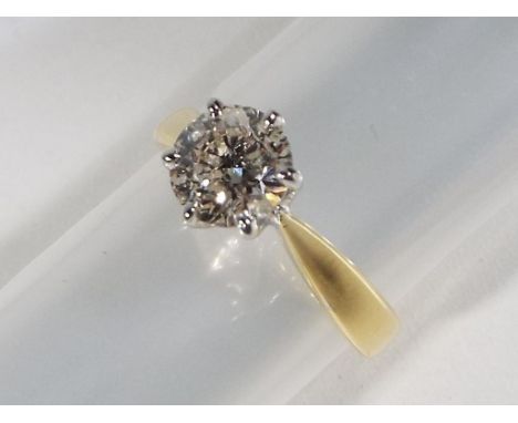 A lady's hallmarked 18 carat yellow gold diamond solitaire, diamond weight .96 carats, H colour SI clarity, 6.2 mm stone, app