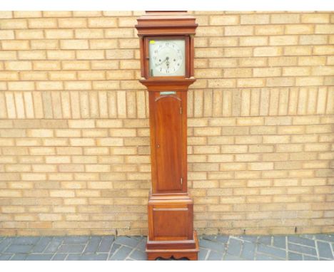 A good mahogany cased English grandmother clock, square silvered dial with applied chapter ring and engraved Arabic numerals 