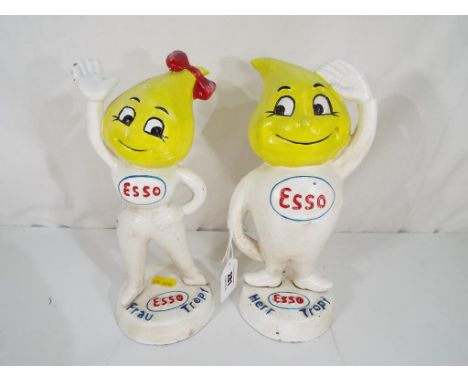 Two cast iron novelty money banks marked Esso