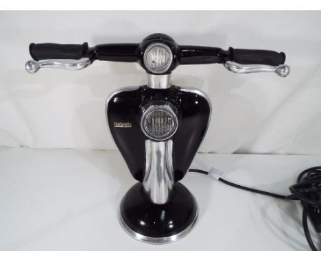 A good quality lamp in the form of a Lambretta scooter. Estimate £55 - £65