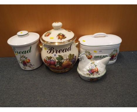 A mixed lot to include three ceramic bread bins and a container for eggs