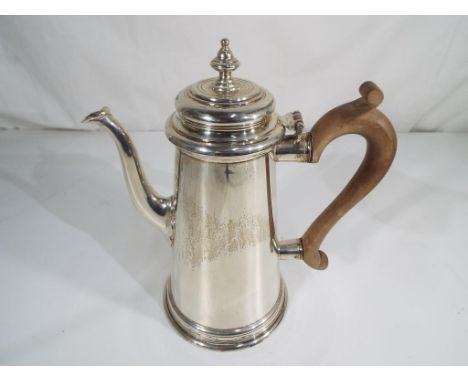 A hallmarked silver coffee pot with wooden handle, clear hallmarks, London assay 1966, no dings or bangs, few minimal surface