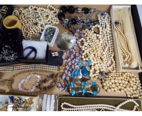 A good mixed lot of predominantly costume jewellery and evening wear to include pearls, cultured pearls, tiger's eye, paired 