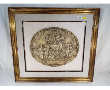 A heavy, oval ceramic framed picture with couples dressed in period clothing, mounted and framed, overall size of frame 63 cm
