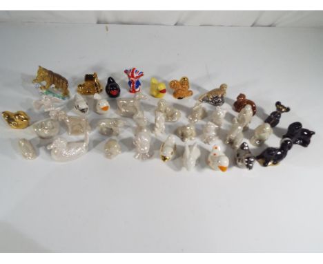 Wade - A collection of approximately 37 Wade Whimsies and Wade Whoppa ceramic figures (predominantly animals) all appear in m