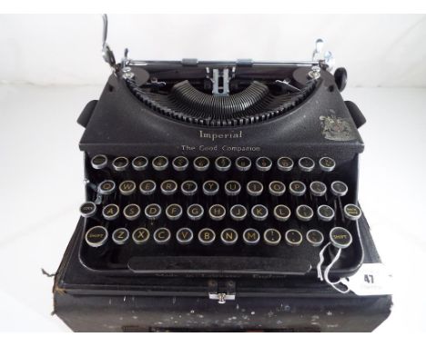 An early 20th century Imperial portable typewriter in hard case
