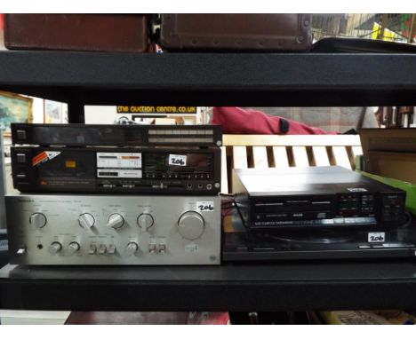 A stereo system to include Technics radio, cassette player, DC Amp, Phillips compact disc player and a  turntable (qty)