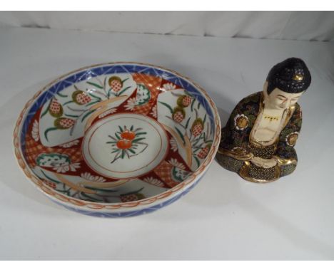 A highly decorated, antique Imari bowl 7 cm (h) x 25 cm (d) and an antique ceramic Buddha 17 cm (h) (2)