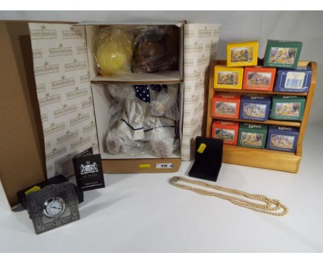 A good quality Ashton - Drake galleries dressed doll, with box, a Lady's triple stranded graduated pearl necklace with white 