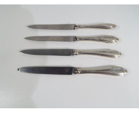 Four silver butter knives, two knives Sheffield assay and two London assay