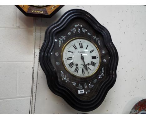 A French vineyard wall clock with mother of pearl inlay, Roman numerals on a white dial inscribed P. Louriac and also Olargue