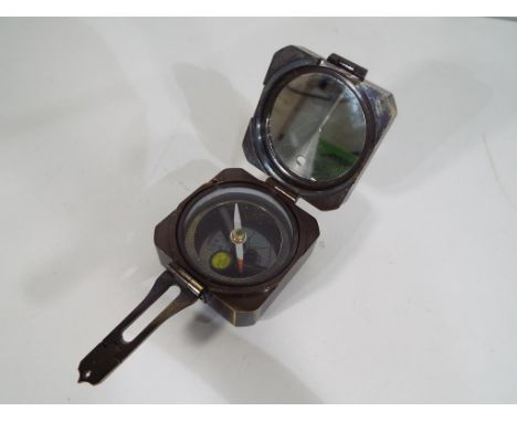 A brass compass by Kelvin and Hughes. Estimate £20 - £30