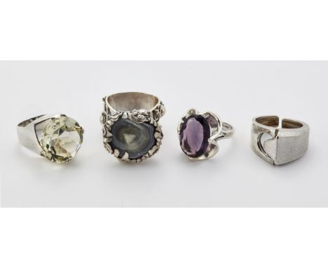 FOUR MODERNIST SILVER RINGS, including&nbsp;A MEXICAN SILVER PURPLE PASTE RING,&nbsp;ring size O1/2;&nbsp;A SILVER CITRINE RI