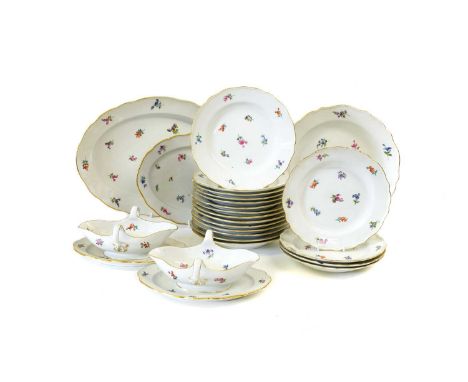 A Meissen Porcelain Part Dinner Service, 20th century, painted with scattered flower sprigs and with gilt rims, crossed sword