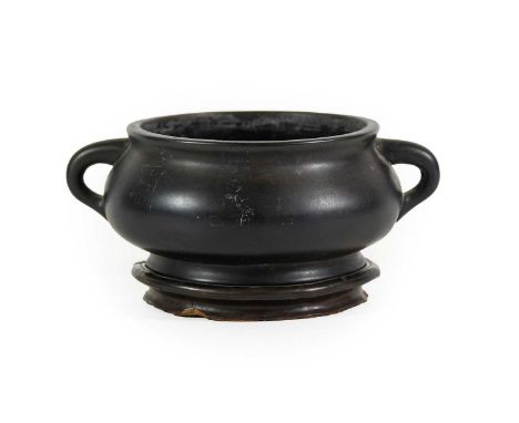 A Chinese Bronze Censer, Xuande reign mark but not of the period, of cushion circular form with loop handles, bears six-chara